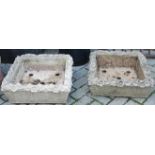 A pair of reconstituted square squat planters, having floral decorated borders, w.53cm