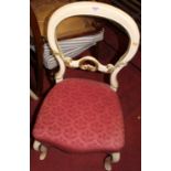 A pair of Victorian and later cream and gilt painted balloon back salon side chairs