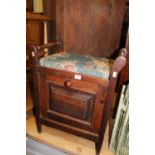 An Edwardian walnut music seat, with fallfront compartment, w.49.5cm