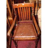 A pair of 1930s barleytwist oak slatback open armchairs, having drop-in pad seats, w.55.5cm