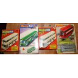 A box containing four Dinky kits, comprising two 1018 Atlantean bus, 1023 single-decker bus, and