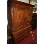 A 19th century North Country oak house-keepers cupboard, having twin upper doors over base fitted