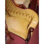 A Victorian mahogany framed settee, of serpentine outline, having a swept back, the whole re-