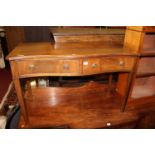 A reproduction mahogany serpentine front two drawer side table, w.107cm