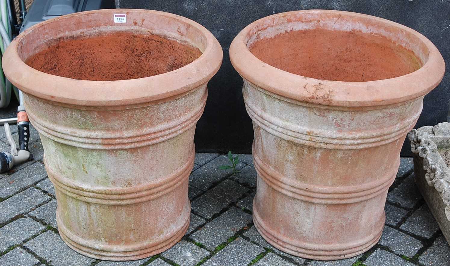 A pair of good quality contemporary terracotta circular planters, of tapering form, by The Italian