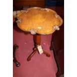 A late Victorian oak fixed and shaped top pedestal tripod occasional table, with floral decorated
