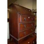 A 1930s oak slopefront three-drawer writing bureau, w.74.5cm