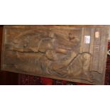 An early 20th century relief carved oak wall panel depicting Icarus