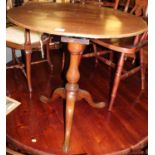 A 19th century mahogany pedestal tilt-top tripod table, having birdcage action, bearing plaque for