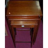 A mahogany and boxwood strung nest of three occasional tables, the largest w.50.5cm