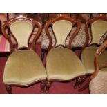 A set of four mid-Victorian mahogany balloon back dining chairs, having green draylon inset pad