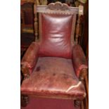 A late Victorian relief carved oak framed parlour suite, comprising; lady's and gent's armchairs,