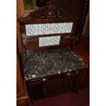 An Edwardian stained walnut variegated marble topped and tile inset wash-stand, the raised