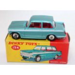 A Dinky Toys No. 134 Triumph Vitesse comprising of metallic blue body with white side flash, red