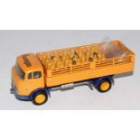 A Tekno No. 911 Mercedes Benz steak truck Cosangas comprising of a yellow body with dark blue