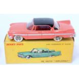 A French Dinky Toys No. 545 De Soto Diplomat comprising of salmon pink body with black roof and