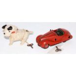 A Schuco tinplate and clockwork vehicle and animal group to include a clockwork mechanism dog with