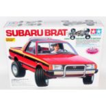 A Tamiya Model No. 58384 1/10 scale radio controlled model of a Subaru Brat Pickup truck, unmade