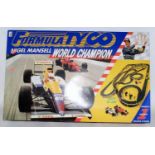 A Tyco Nigel Mansell World Champion F1 slot racing set, used example but appears near complete
