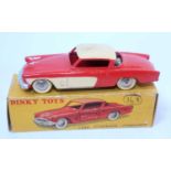 A French Dinky Toys No. 540 Studebaker Commander comprising of orange and cream body with spun