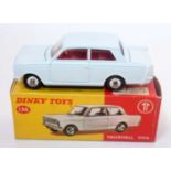 A Dinky Toys No. 136 Vauxhall Viva saloon comprising of white body with red interior and spun hubs