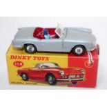 A Dinky Toys No. 114 Triumph Spitfire saloon comprising of silver body with red interior, spun