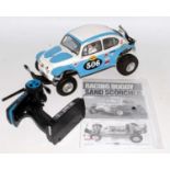 A Tamiya 1/10 scale kit built model of a radio controlled High Performance Racing Buggy Sand