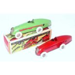 A Triang Minic tinplate and clockwork No.1 race car finished in red with white wheels and spun