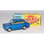 A Corgi Toys No. 251 Hillman Imp comprising of metallic blue body with a yellow interior, spun