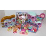 Two boxes containing a large quantity of Littlest Pet Shop action figures, soft toys, and