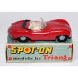 A Spot-On models by Triang No. 107 Jaguar XKSS saloon comprising red body with cream interior,