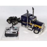 A Tamiya 1/14 scale Radio controlled kit built model of a Grand Hauler truck, finished in purple