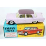 A Corgi Toys No. 232 Fiat 2100 saloon comprising of pale pink body with mauve roof and lemon