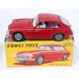 A Corgi Toys No. 327 MGB GT comprising of red body with light blue interior and cast wirework