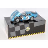 A Exoto Racing Legends 1/18 scale model of a 1964-65 Cobrid Daytona finished in light metallic