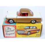A Corgi Toys No. 231 Triumph Herald Coupe comprising of gold and white body with red interior and