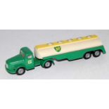 A Tekno No. 434 BP Air Volvo articulated tractor unit and trailer comprising of green white and