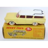 A Dinky Toys No. 193 Rambler Cross Country station wagon comprising yellow body with white roof, red