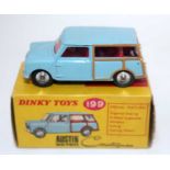 A Dinky Toys No. 199 Austin Countryman comprising of light blue body with red interior and spun