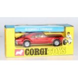 A Corgi Toys No. 276 Oldsmobile Toronado comprising of metallic red body with cream interior, housed