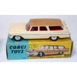 A Corgi Toys No. 219 Plymouth Sports Suburban station wagon comprising of cream body with brown roof