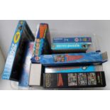 A box of various Thunderbirds related vintage and modern release puzzles and postcards, mixed