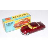 A Corgi Toys No. 259 Le Dandy Coupe comprising of metallic dark red body with lemon yellow