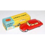 A Corgi Toys No. 210S Citroen DS19 comprising of red body with lemon interior and spun hubs in the