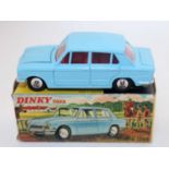 A Dinky Toys No. 162 Triumph 1300 saloon comprising light blue body with red interior and spun