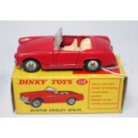 A Dinky Toys No. 112 Austin Healey Sprite saloon comprising red body with cream interior and spun