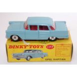 A Dinky Toys No. 177 Opal Kapitan comprising of light blue body with red interior and spun hubs