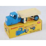 A Dinky Toys No. 415 mechanical horse and open wagon, comprising of blue tractor unit and cream
