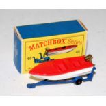A Matchbox No. 48 trailer with removable sports boat comprising of dark blue trailer with black