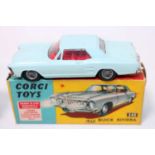 A Corgi Toys No. 245 Buick Riviera comprising of light blue body with wirework hubs and red